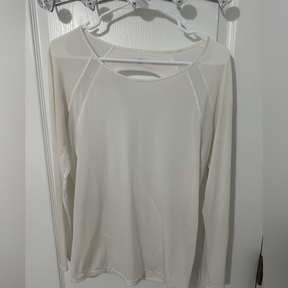 Long sleeve very thin material see through. Of white color